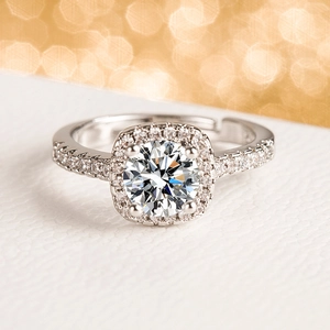 Adjustable silver halo engagement ring featuring a sparkling round zircon and micro-pavé band