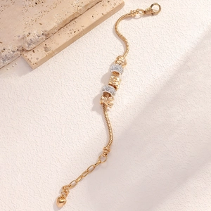 Golden snake chain bracelet with crown and gift box beads and a heart pendant