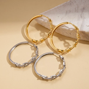 U-shaped geometric hoop earrings in 18K gold and silver plating with zircon stones