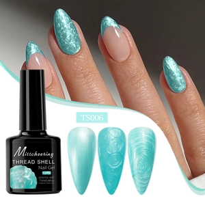Macro detail of mint green thread shell nail gel with textured pearl finish on nails