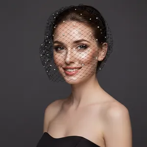 Close-up of black mesh veil headband with sparkling white rhinestones for wedding party