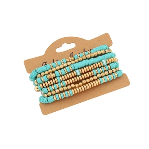 6-piece turquoise and gold beaded layered bracelet set on a brown display card
