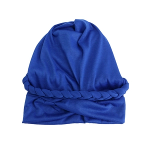 Detailed view of the royal blue braided knit pattern on the elastic turban hat for women