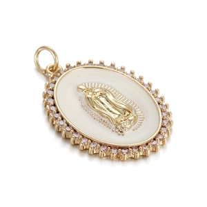 Golden oval Virgin Mary pendant with white enamel and pink crystal border on white background