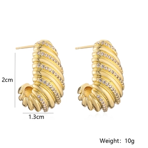 Detail view of gold ribbed twisted earrings with zircons including size and weight specs