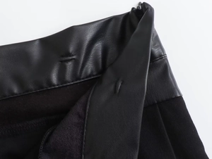 Detailed close-up of high-quality faux leather texture and durable black fabric lining