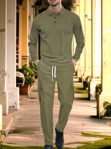 Detail of army green waffle knit texture on men's long sleeve polo and pants set