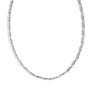 Close-up of silver geometric link chain necklace with polished twisted buckle texture