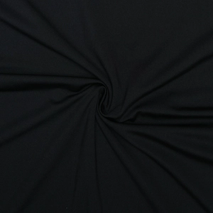 Close-up detail of soft black knit fabric showing the texture and elegant draped folds