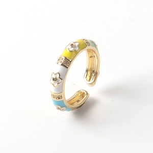 Close-up of adjustable 18K gold plated ring with colorful enamel flowers and zircons