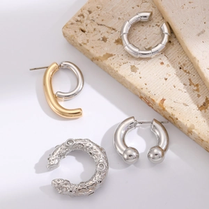 Gothic punk metal earring set including silver bamboo hoops and lava texture ear cuffs