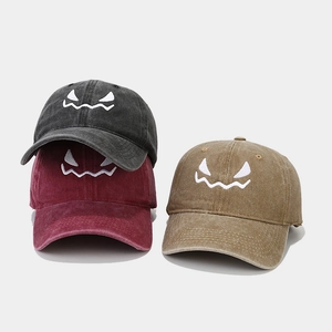 Distressed washed cotton baseball cap with Halloween ghost embroidery in three colors