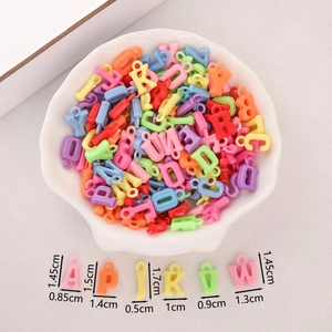 Detailed size chart of macaron acrylic alphabet beads in a shell plate for DIY jewelry