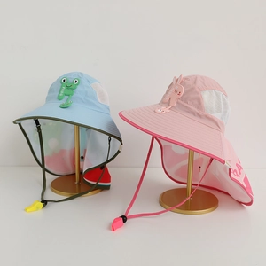 Close-up of children's sun hats with cartoon patterns and breathable mesh side panels