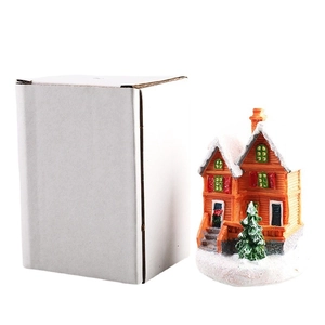 Miniature resin Christmas house with snow decor and green tree including packaging box