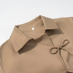Women's khaki trench coat with sweet bow-tie collar and minimalist button design