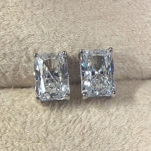 Detailed macro view of radiant cut square cubic zirconia earrings with four-prong silver setting