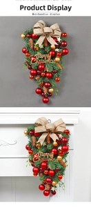 Christmas teardrop swag with red and gold baubles, pinecones, and Merry Christmas sign
