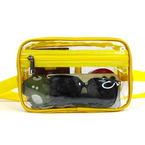 Detail view of yellow clear PVC waist bag with adjustable strap and zip closure