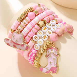 Detail of pink clay bead bracelet set with Howdy Cowgirl letter beads and boot charm