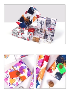 Detail of London themed wrapping paper with Big Ben and red bus patterns for DIY gifts