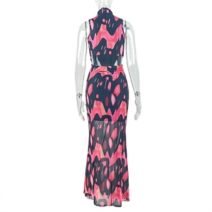 Detail of pink and black abstract flame print on back cutout of a high-neck maxi dress