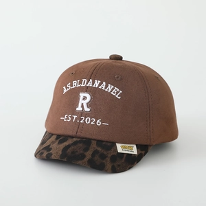 Detail of suede kids baseball cap with leopard print brim and R letter embroidery