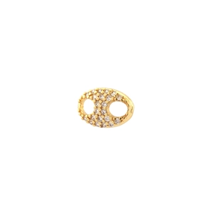 Macro view of gold plated oval link pendant encrusted with pavé cubic zirconia crystals
