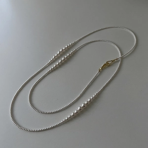 Elegant long pearl necklace with gradient sizes and gold S-hook clasp for women