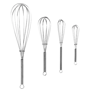 Set of four stainless steel spring handle whisks in various sizes on a white background