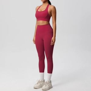 Detail view of burgundy yoga set featuring racerback top and leggings with side pockets