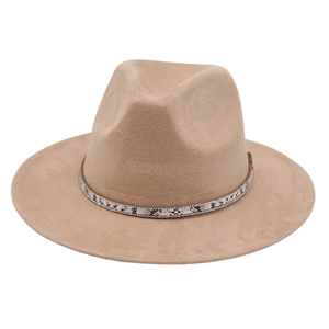 Detail of elegant beige fedora hat featuring a snakeskin band with rhinestone accents