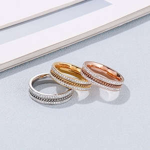 Three-piece stainless steel eternity ring set with chain texture and cubic zirconia crystals