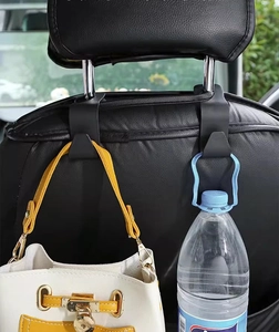 Car seat headrest hook showing white handbag and bottled water hanging in car interior