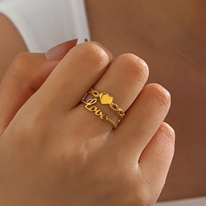 Golden heart ring and LOVE script band set in stylish stacked stainless steel for women