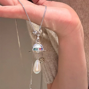Saturn orb necklace with colorful crystals and teardrop pearl on vintage silver chain