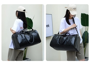 Bolsa de viaje cilíndrica de cuero PU negro con correa ajustable y asas para el hombro