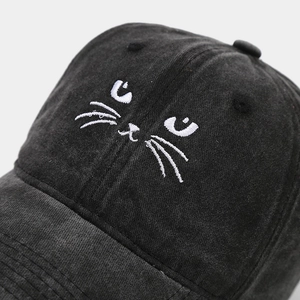 Retro black baseball cap with white cat embroidery and premium cotton texture