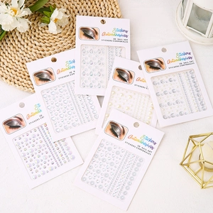 Flat lay of 3D self-adhesive pearl and rhinestone stickers for face and body art