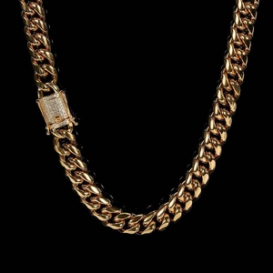 Close-up of 12mm gold Cuban link chain featuring a luxury diamond-set buckle and polished finish