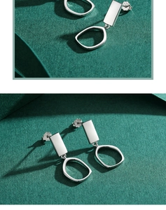 Macro shot of S925 sterling silver geometric earrings featuring rectangular and circular studs