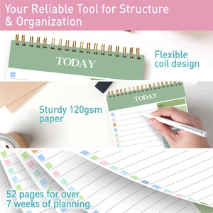 Detail view of green coil planner showing flexible spiral binding and thick 120gsm paper
