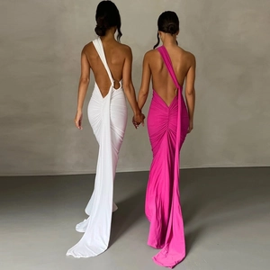 Detail of elegant open back maxi dress featuring ruching and chic metal ring buckle