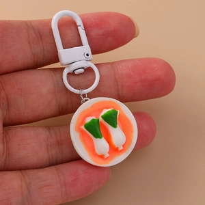Realistic miniature bok choy food keychain with white plate and orange sauce charm