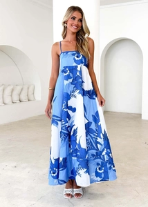 Detail of summer backless floral maxi dress with blue and white flower print