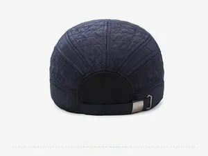 Rear view of navy blue quilted baseball cap with diamond pattern and adjustable metal buckle
