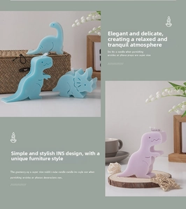 Detailed close-up of matte dinosaur scented candles in Morandi blue and purple tones