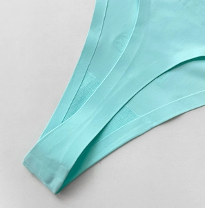 Detail of mint blue seamless ice silk fabric with breathable knit texture and edge