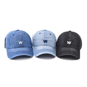 Vintage washed denim baseball cap with W embroidery in blue and black colors