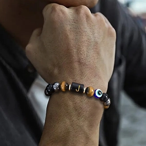 Tiger eye and black onyx beaded bracelet with evil eye charm and golden letter J charm